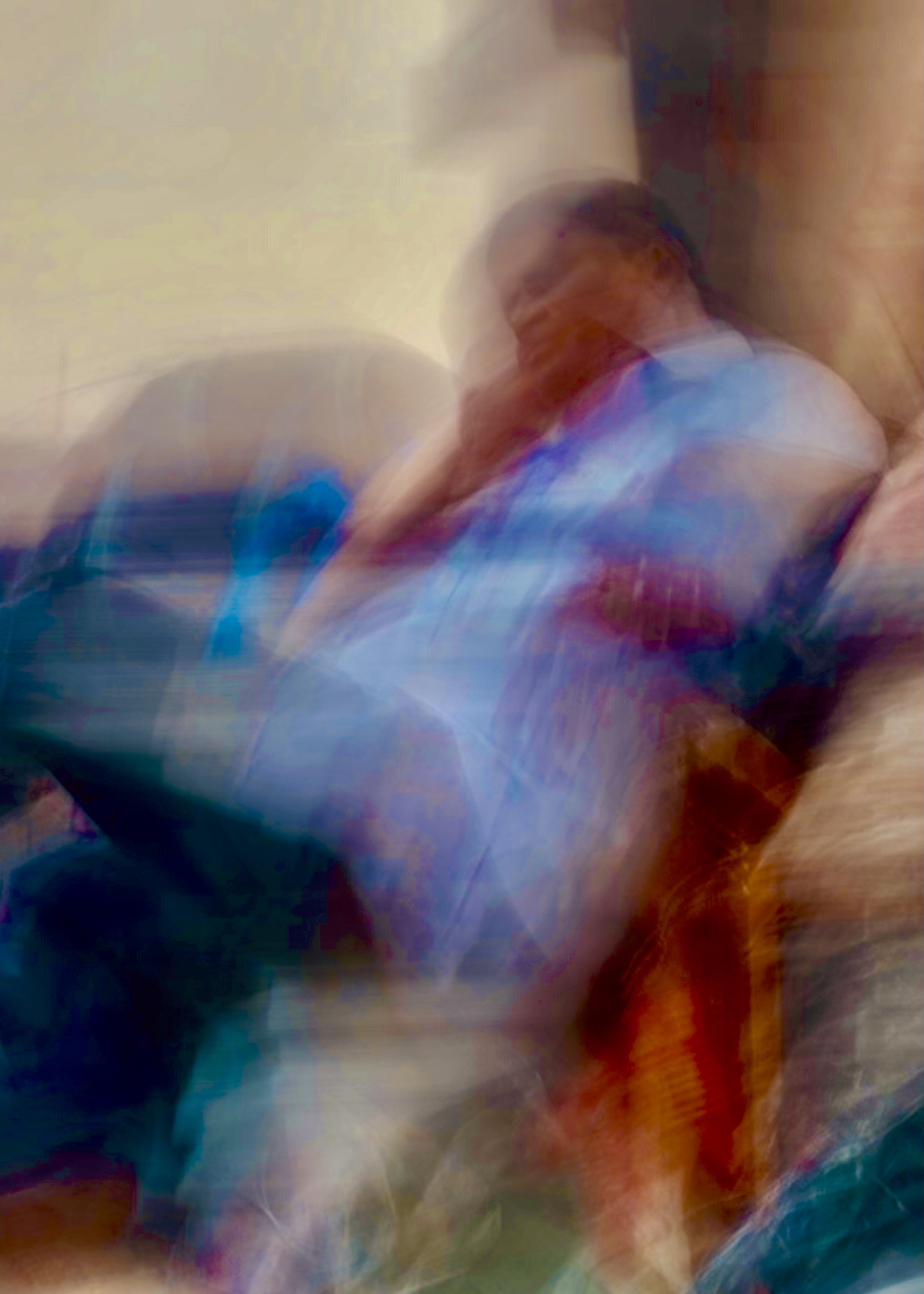 Abstract motion blur with vibrant blues, purples, and warm tones showing figures in transition - Crossings photography series