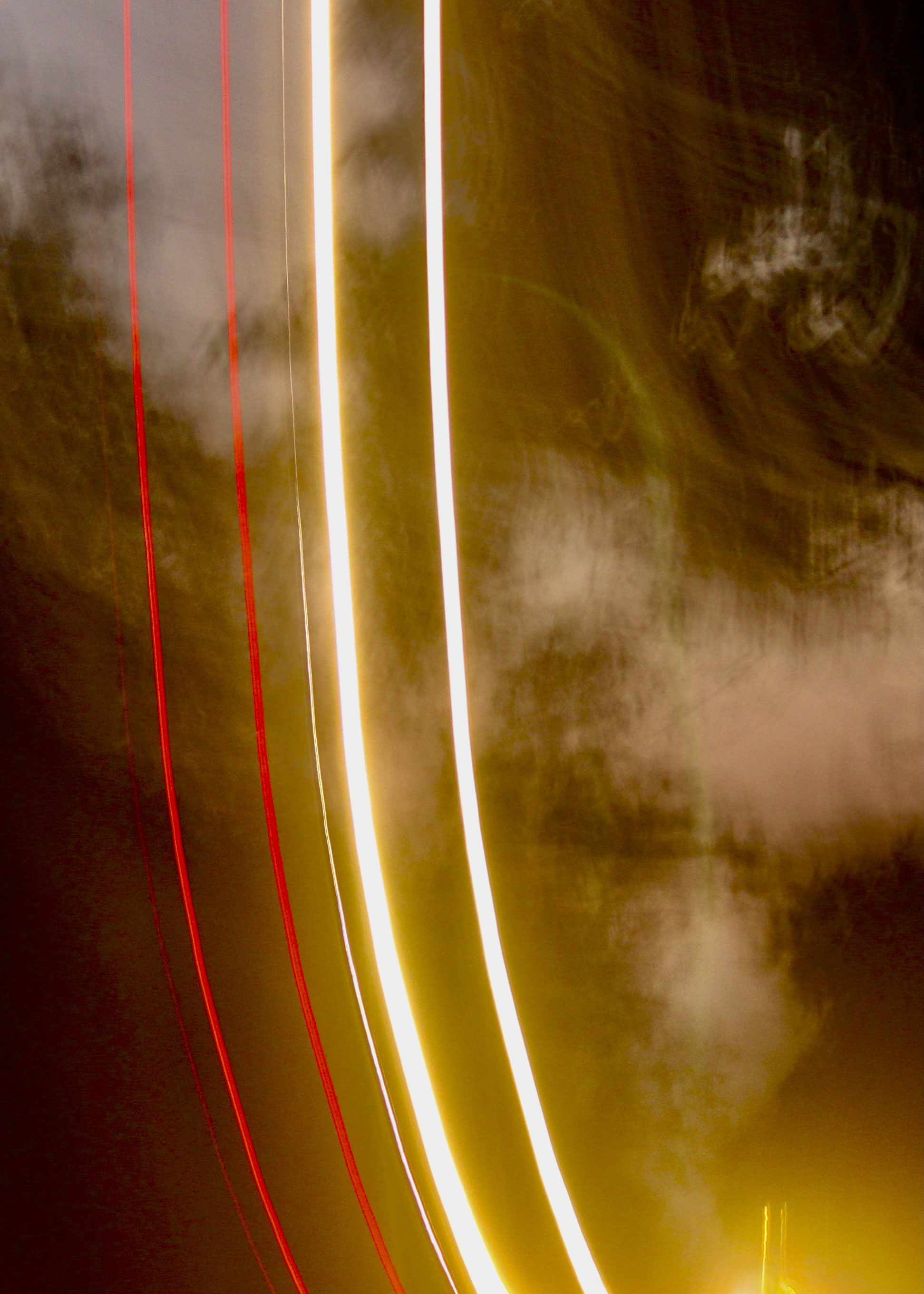 Abstract light trails in red and golden colors - experimental photography